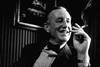 IFI1030_M_1963_IAN_FLEMING_SMOKING_AT_LONDON_DESK_ALAMY_B502GF
