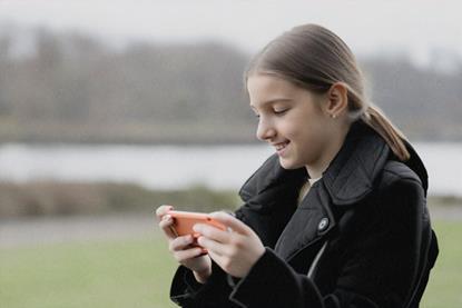 girl watching video on laptop