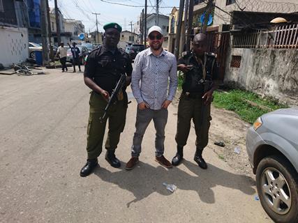 1 AP Alex Levitschi flanked by security on our Lagos shoot