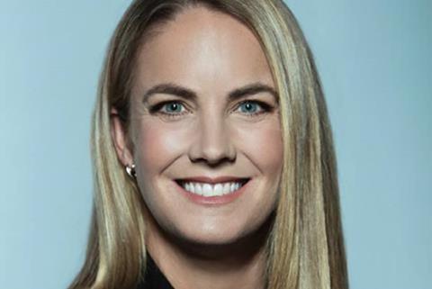 Head shot of Kelly Campbell, a woman with long blonde hair, smiling at the camera
