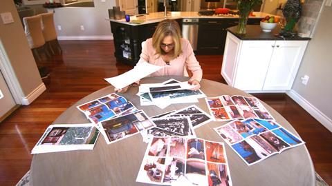 Detective Sergeant Jan Beasant reviews forensic photographs taken at Reveshi's Hornby Road residence