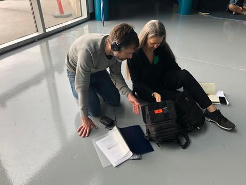 Helen Thomas and Rob Liddell looking at montior