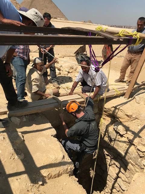 Gwyn Williams descends burial shaft at Giza Pyramids