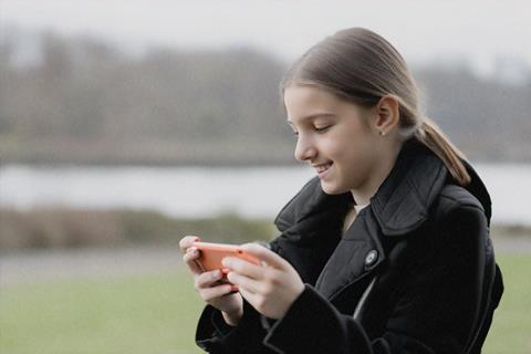 girl watching video on laptop