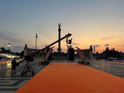 A jib operator in Budapest's Heroes Square at dawn